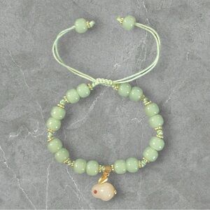 NWOT Light Green Bracelet with White Rabbit Charm
